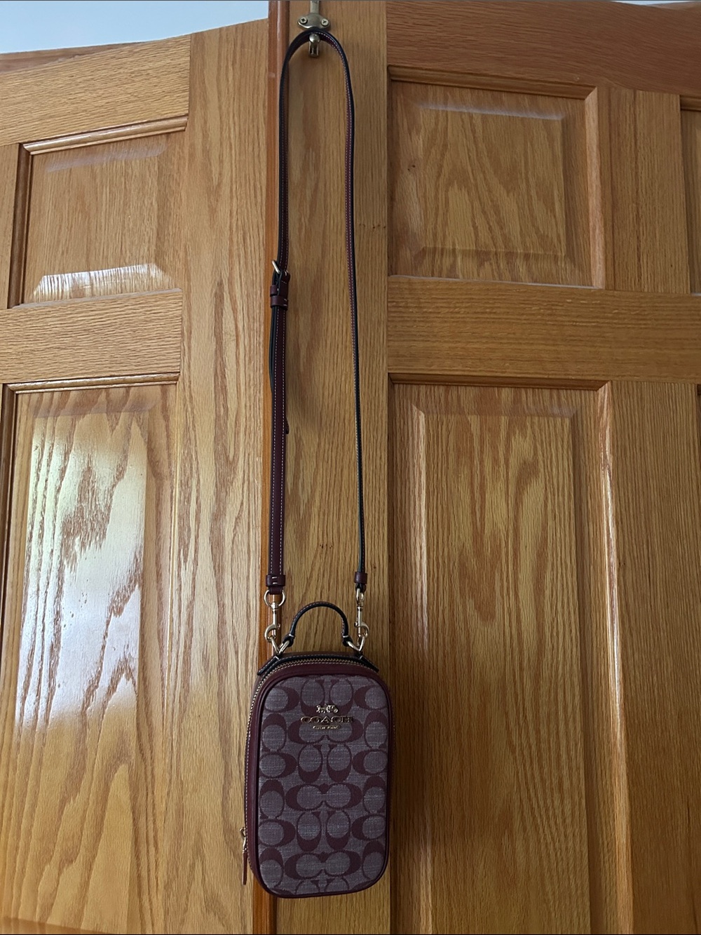 Coach maroon Signature Monogram Crossbody Phone Case